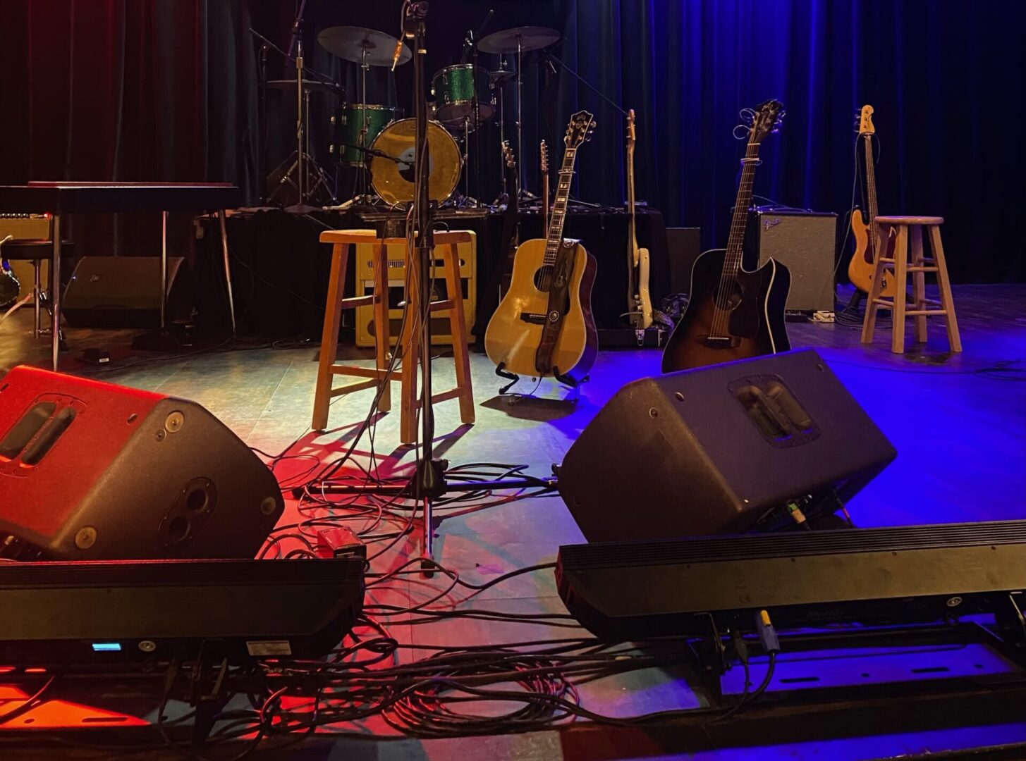 A stage with guitars and amps on it